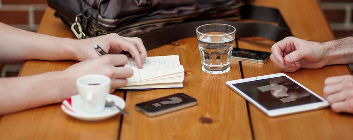 A collection of mobile devices at a meeting